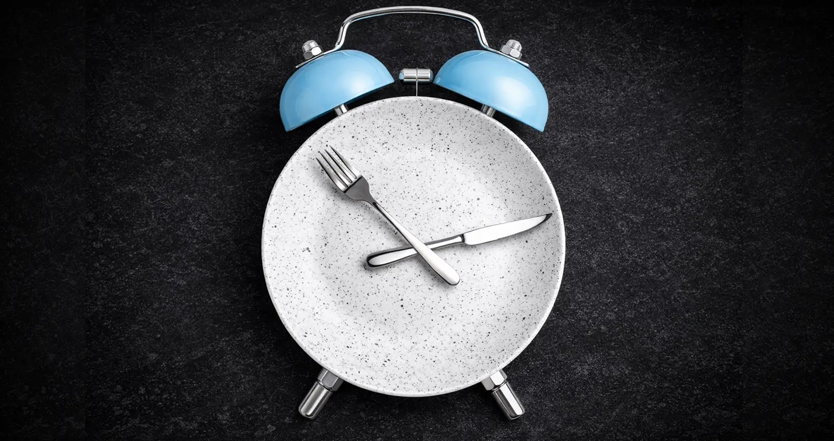 clock on plate symbolizing fasting for fertility
