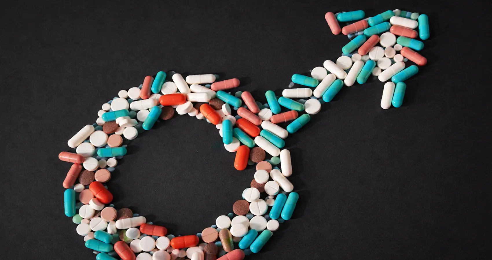 Antioxidant supplements poured in the form of a male symbol