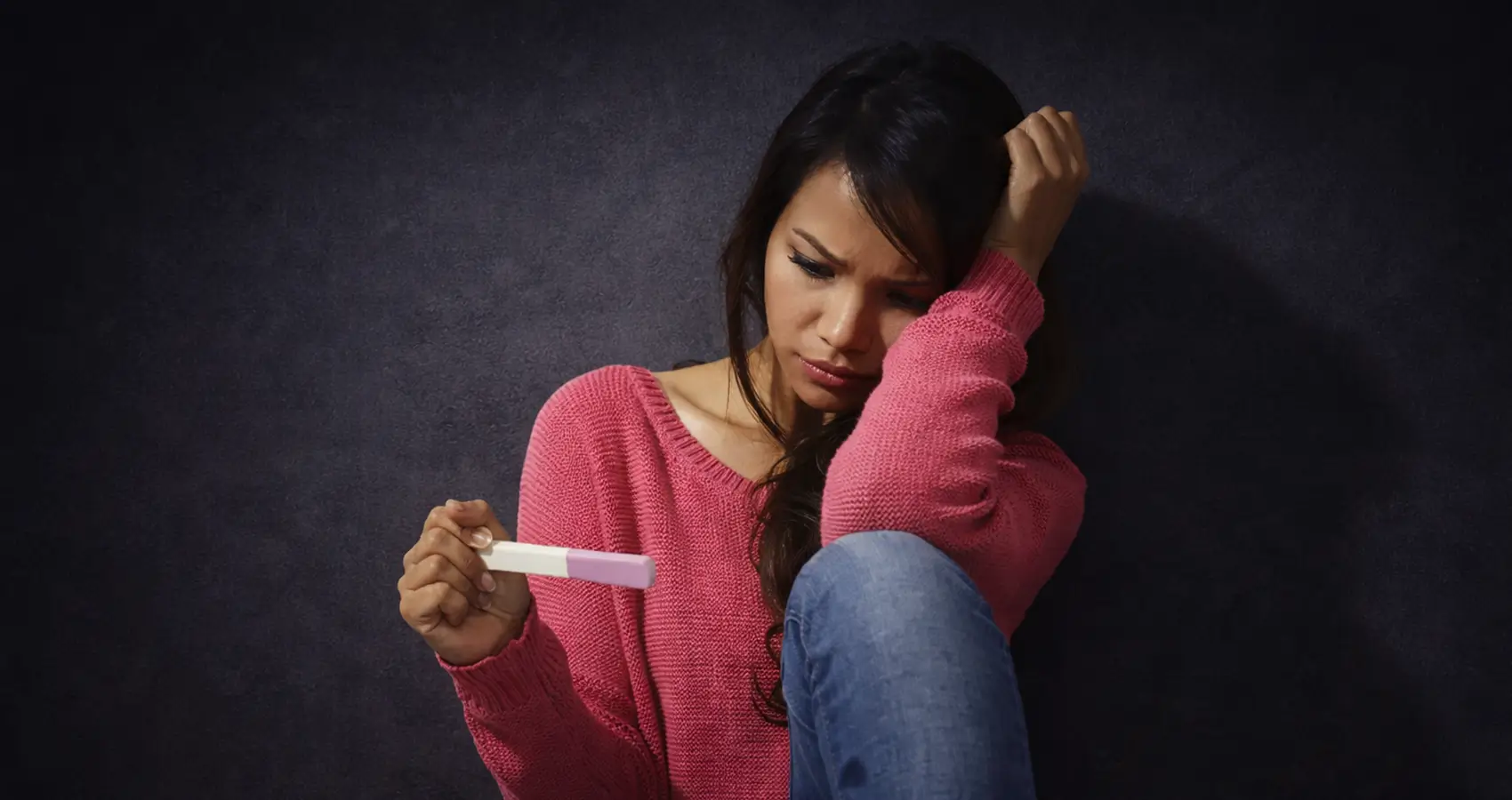 Woman with Pregnancy Test in Hand Feeling Stressed About Trying to Conceive